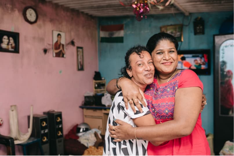 Two Indian LGBTQ activists embrace